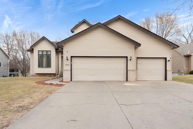 ranch-style home featuring a front lawn, driveway, a garage, and brick siding