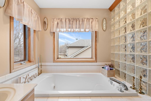 bathroom featuring vanity and a bath