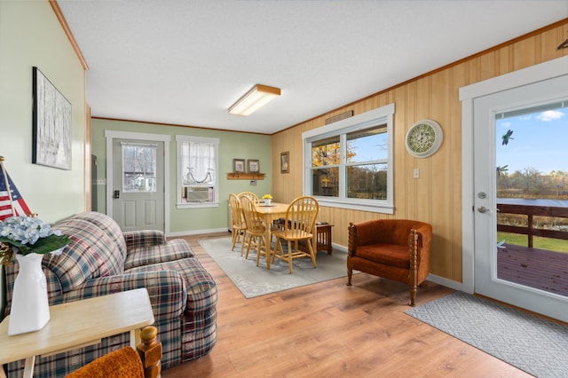 37760 310th St, Aitkin, MN 56431 - dining area featuring ornamental molding, light wood-style flooring, baseboards, and cooling unit