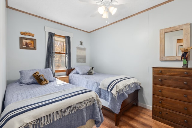 37760 310th St, Aitkin, MN 56431 - bedroom featuring ornamental molding, wood finished floors, ceiling fan, and baseboards