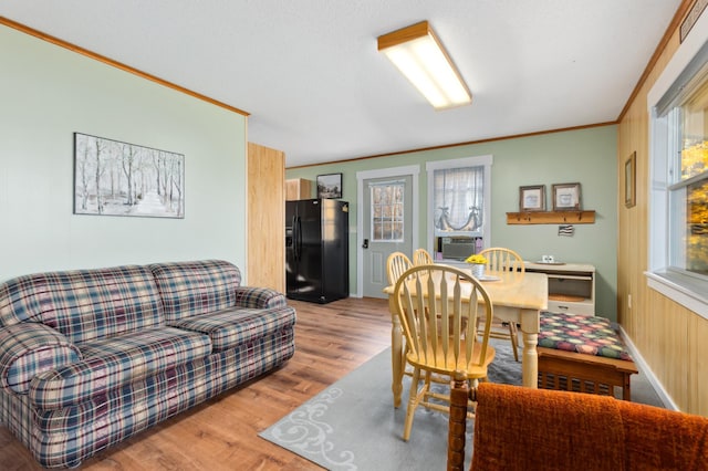 37760 310th St, Aitkin, MN 56431 - dining room featuring wood finished floors, crown molding, and cooling unit
