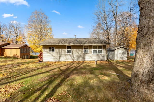 37760 310th St, Aitkin, MN 56431 - rear view of property with an outdoor structure and a yard