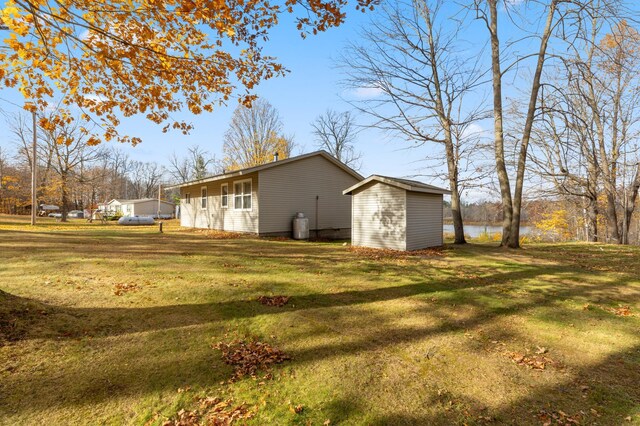 37760 310th St, Aitkin, MN 56431 - view of side of property featuring a yard