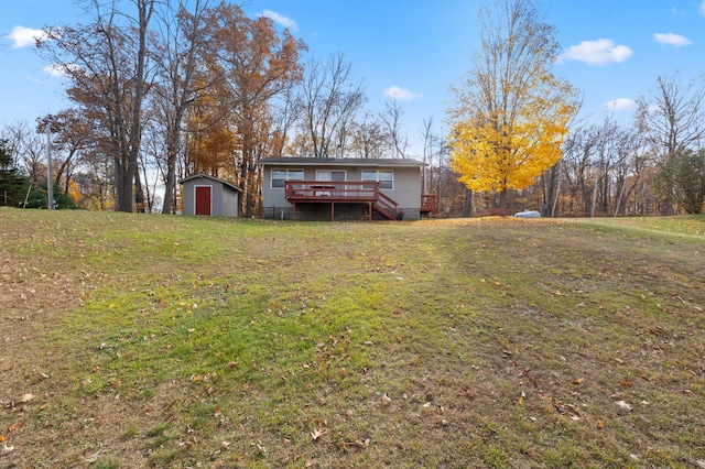 37760 310th St, Aitkin, MN 56431 - back of property with a deck and a yard