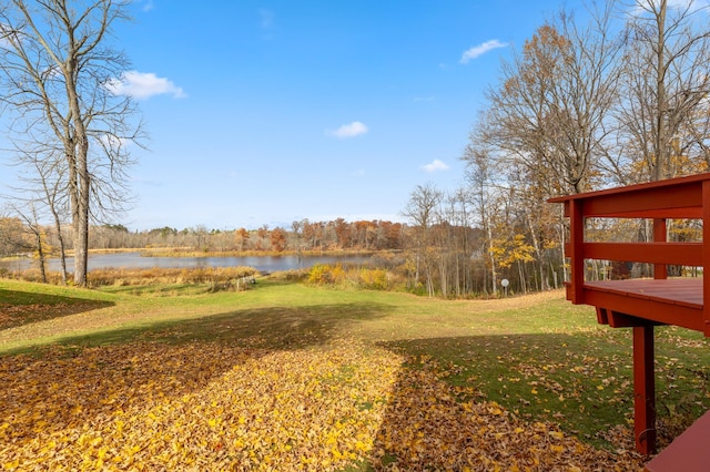 37760 310th St, Aitkin, MN 56431 - view of green lawn featuring a deck with water view
