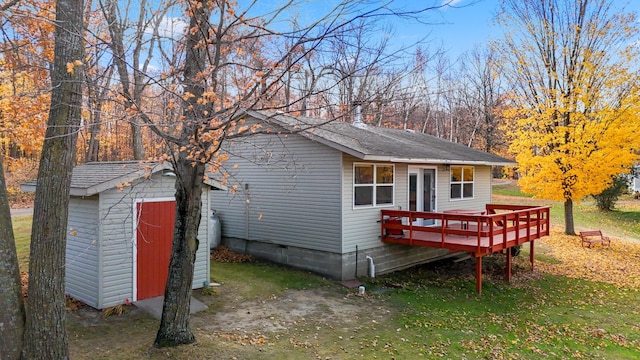 37760 310th St, Aitkin, MN 56431 - view of front of house featuring a deck and a shingled roof