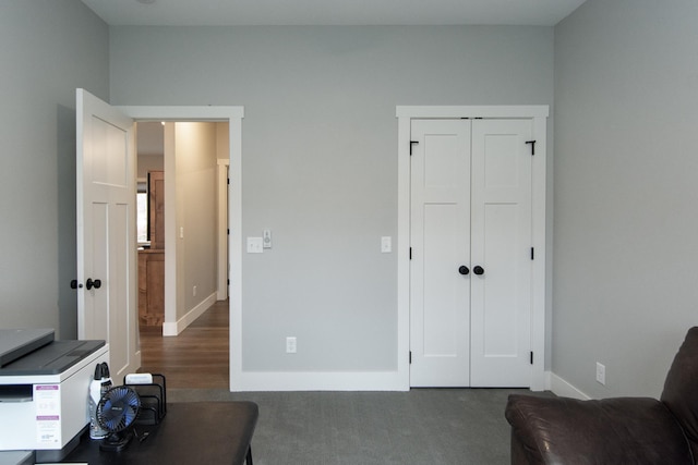 interior space featuring dark colored carpet