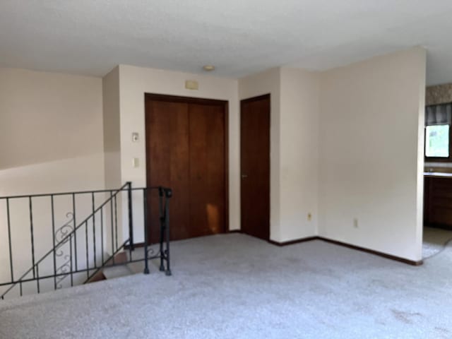 unfurnished room with carpet floors