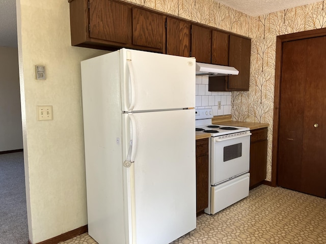 kitchen with range with electric cooktop, a textured ceiling, backsplash, and white refrigerator