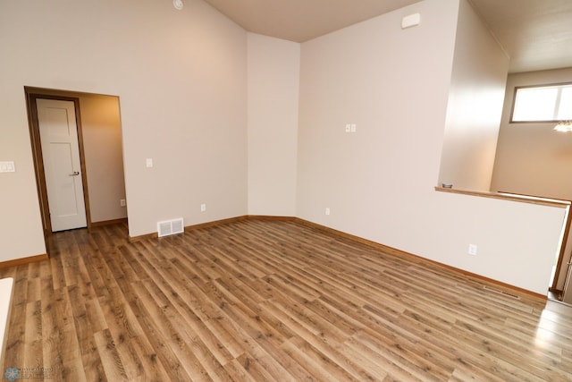 spare room featuring wood-type flooring