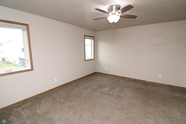 empty room with carpet and ceiling fan