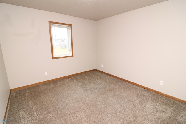 view of carpeted spare room