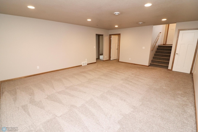 empty room with light colored carpet