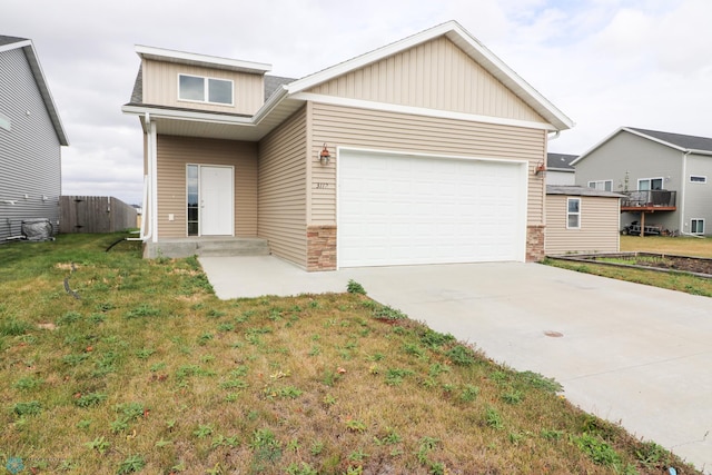 view of front facade with a front yard and a garage