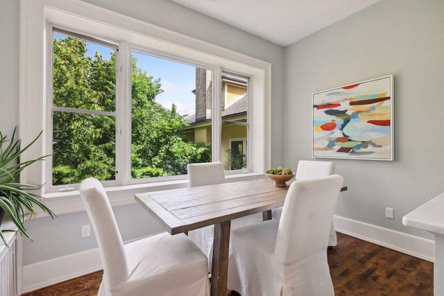 dining area featuring dark hardwood / wood-style floors