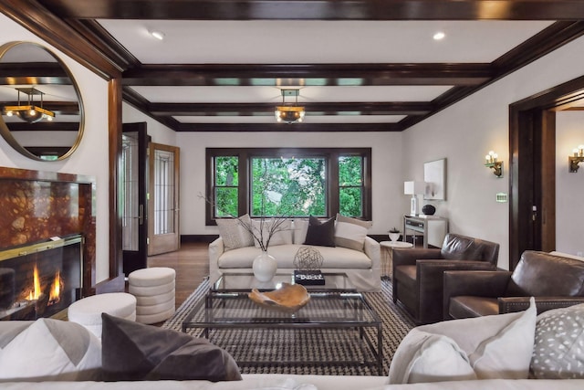 living room with beam ceiling, a premium fireplace, and hardwood / wood-style floors