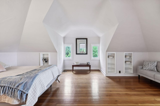 bedroom featuring lofted ceiling and hardwood / wood-style flooring