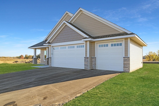 garage featuring a yard