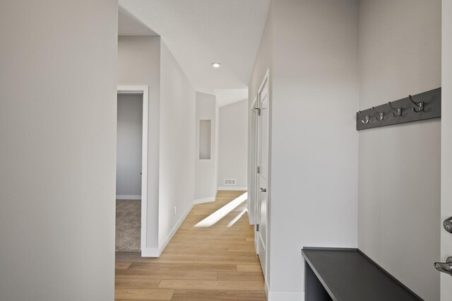 corridor featuring light hardwood / wood-style flooring