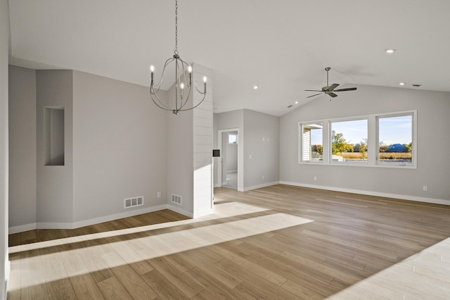 interior space with vaulted ceiling, light hardwood / wood-style flooring, and ceiling fan with notable chandelier