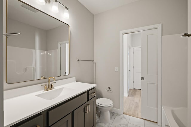 bathroom featuring vanity and toilet