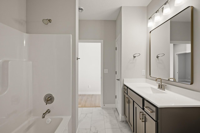 bathroom with vanity and bathing tub / shower combination