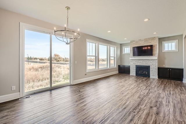 2711 Buffalo Ridge Dr, Buffalo, MN 55313 - unfurnished living room featuring an inviting chandelier, wood finished floors, and baseboards