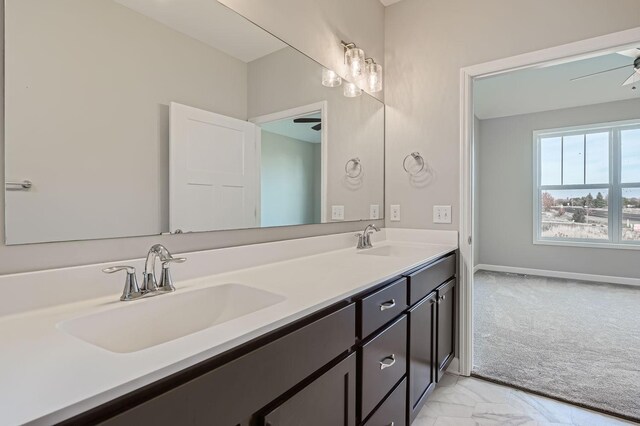 2711 Buffalo Ridge Dr, Buffalo, MN 55313 - bathroom with double vanity, marble finish floor, ceiling fan, and a sink