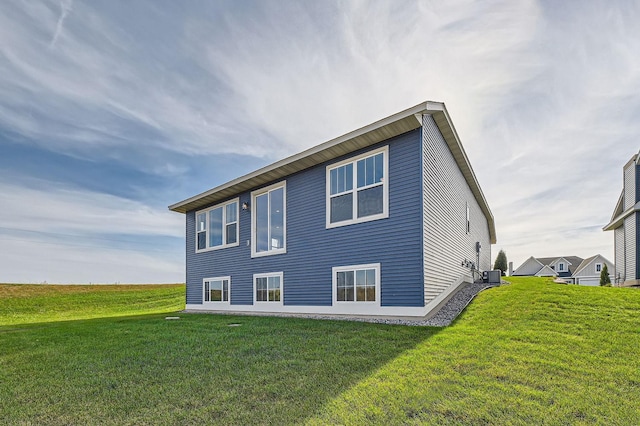 2711 Buffalo Ridge Dr, Buffalo, MN 55313 - back of house with a yard and central AC unit