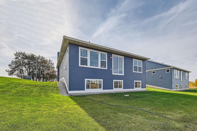 2711 Buffalo Ridge Dr, Buffalo, MN 55313 - back of house featuring a lawn