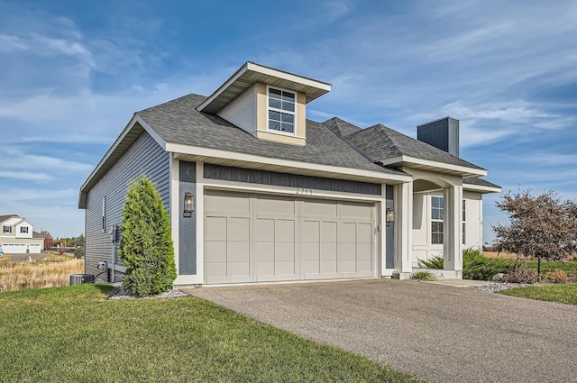 2711 Buffalo Ridge Dr, Buffalo, MN 55313 - view of front of home with an attached garage, central AC, a shingled roof, a front yard, and aphalt driveway