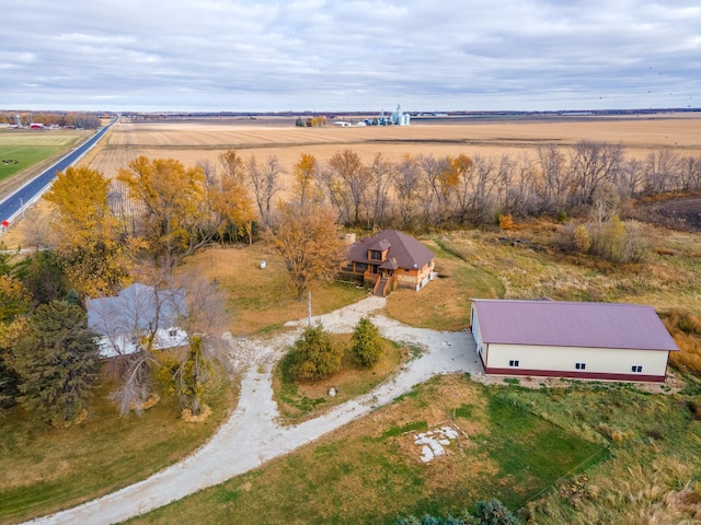 birds eye view of property with a rural view