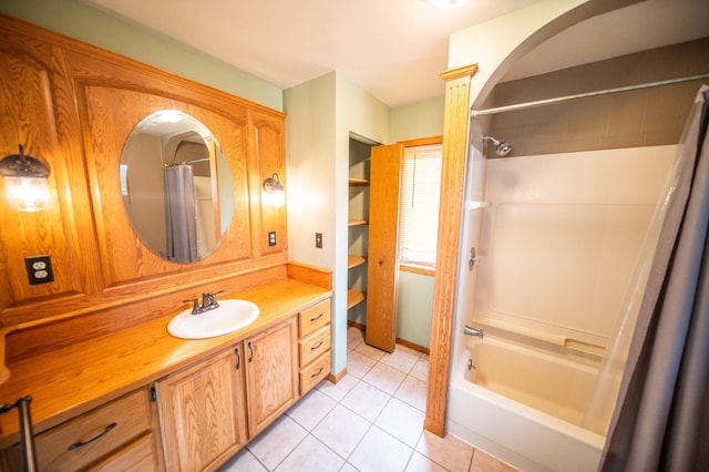 bathroom featuring tile patterned floors, shower / tub combo with curtain, and vanity