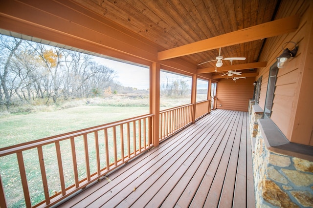 deck featuring a yard and ceiling fan