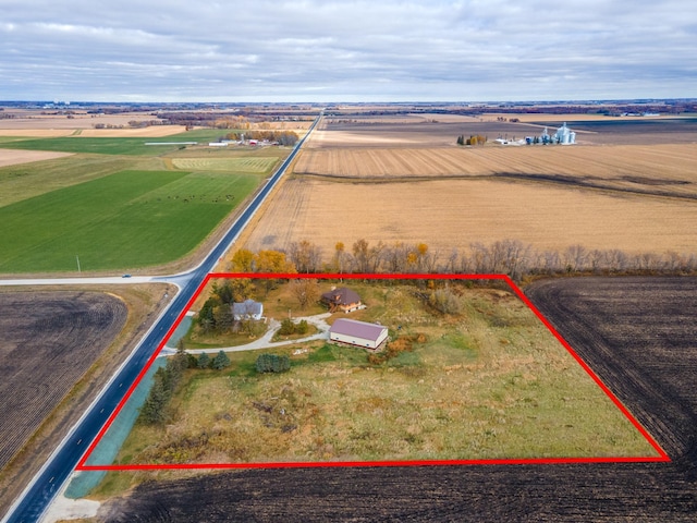 birds eye view of property featuring a rural view