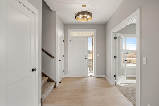 foyer with light hardwood / wood-style floors