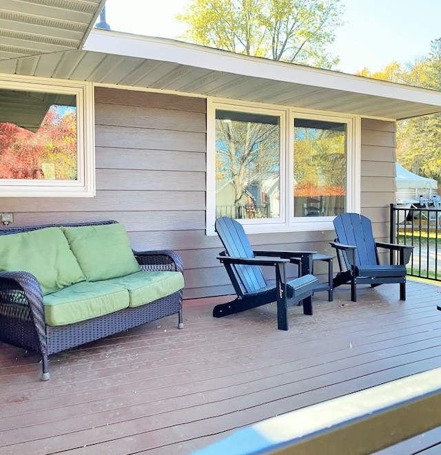 deck with an outdoor hangout area