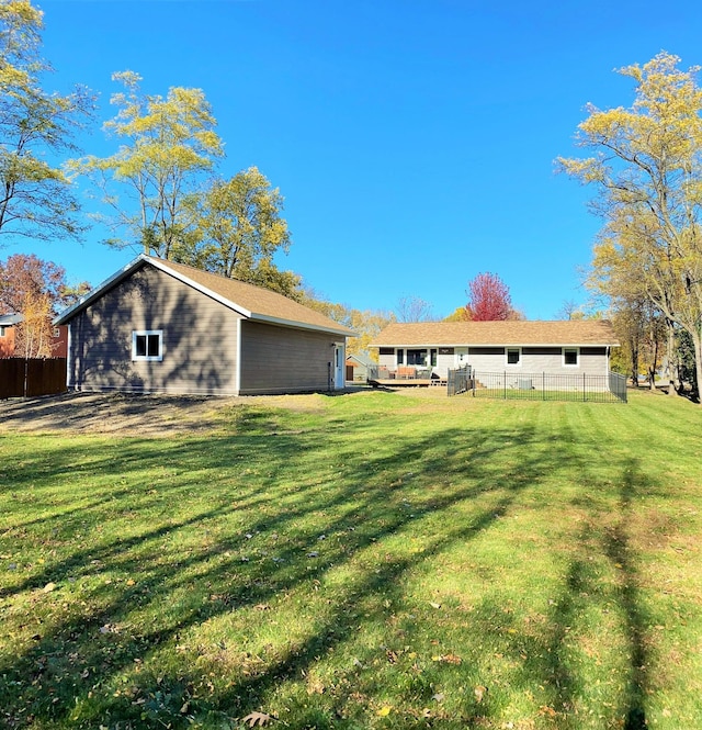 rear view of house featuring a yard