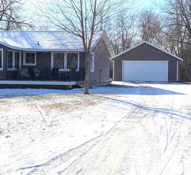 single story home with an outbuilding and a garage