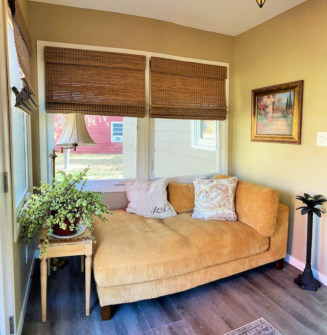 living room with wood finished floors and baseboards