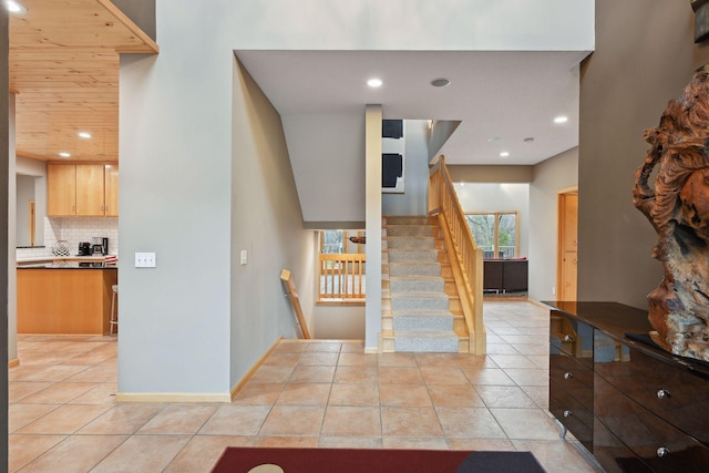 staircase featuring tile patterned floors