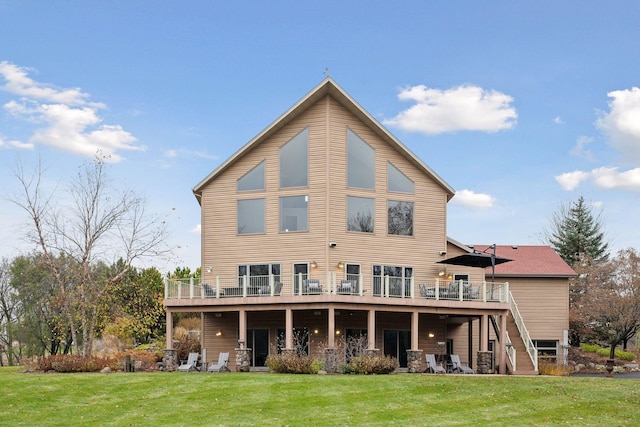 rear view of property with a lawn