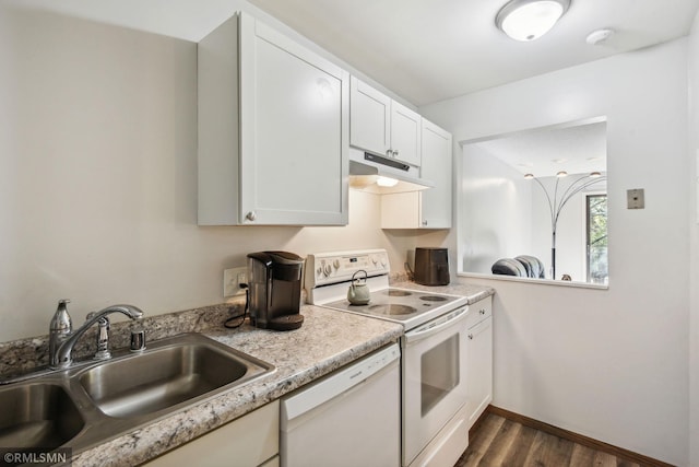 kitchen featuring white appliances, sink, dark hardwood / wood-style floors, and white cabinets