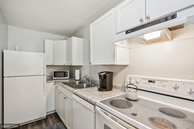 kitchen with sink, dark wood-type flooring, white cabinetry, and white appliances