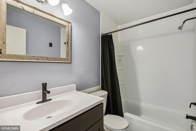 full bathroom featuring vanity, toilet, and shower / bath combo with shower curtain