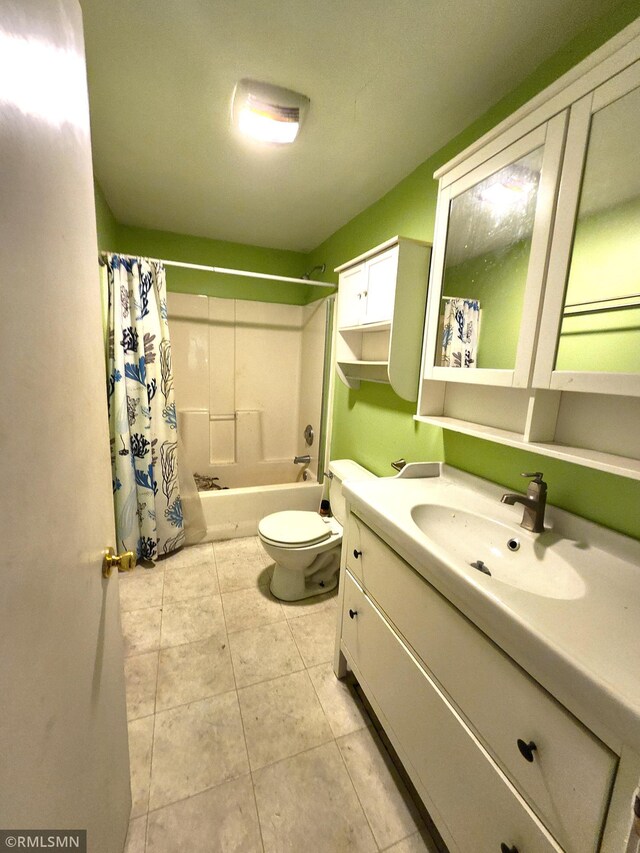 full bathroom with vanity, toilet, shower / bathtub combination with curtain, and tile patterned flooring