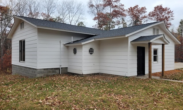 view of side of property with a yard