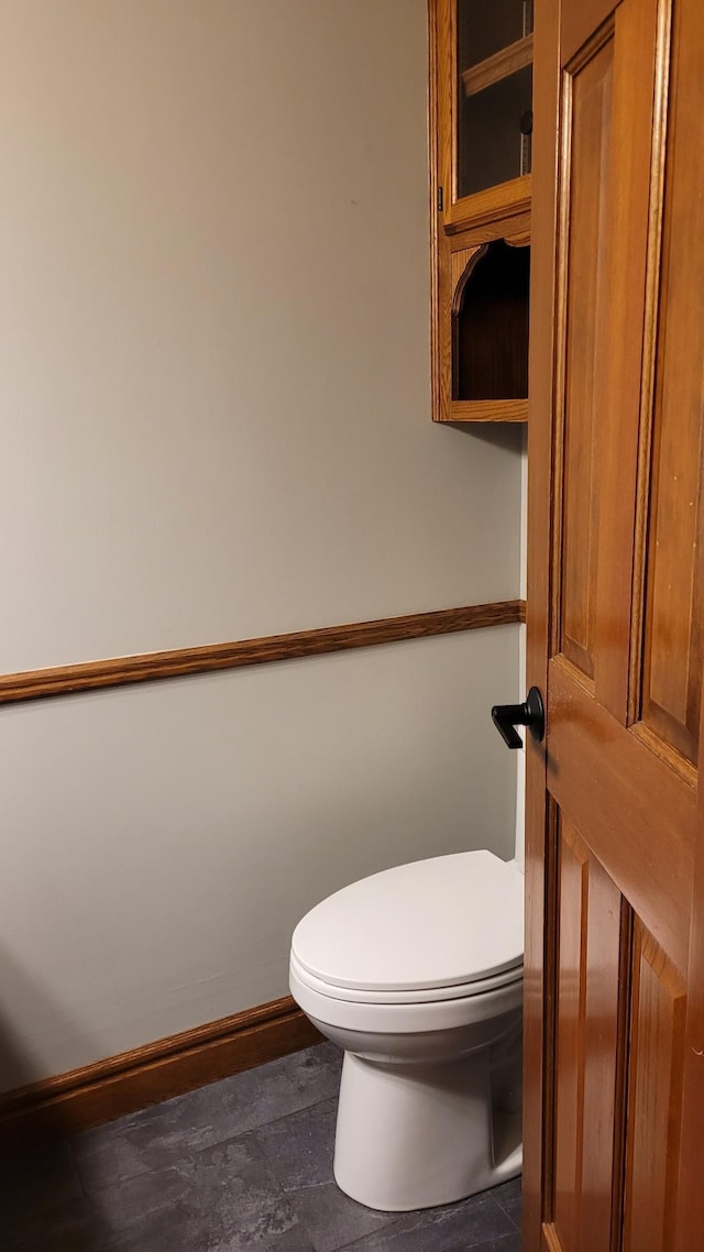 bathroom featuring toilet and tile patterned floors