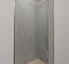 bathroom with tiled shower