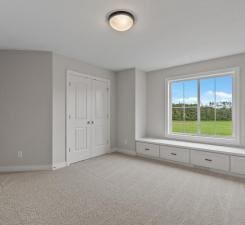 interior space featuring light colored carpet